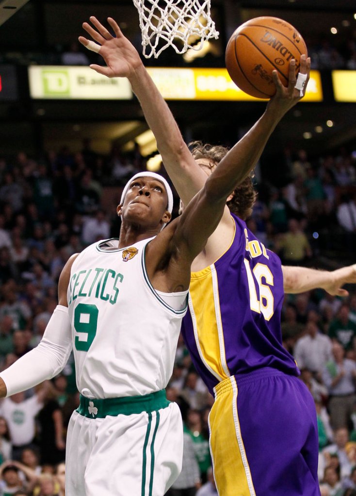 Rajon Rondo of the Boston Celtics slips a shot over Pau Gasol of the Los Angeles Lakers during the first quarter of the Lakers’ 91-84 victory Tuesday night in Boston. The Lakers lead the series, 2-1.