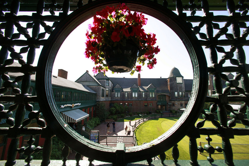 The International Tennis Hall of Fame & Museum in Newport, R.I., is seen through a trellis.