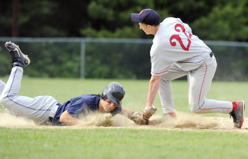 Campbell Belisle-Haley of Yarmouth dives back to second base as Jack Martell of Gray-New Gloucester takes the pickoff throw Wednesday. Yarmouth won, 8-6.