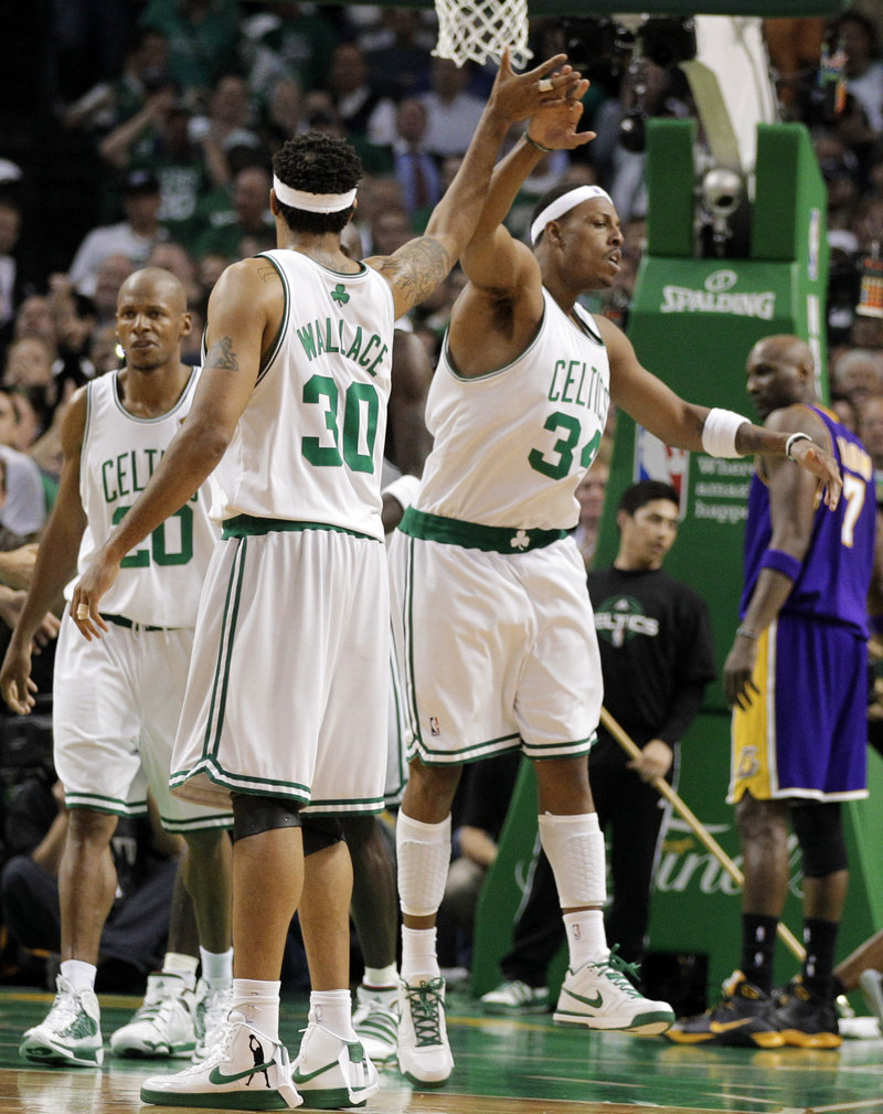 Rasheed Wallace and Paul Pierce of the Boston Celtics celebrate a fourth-quarter basket Thursday night. The Celtics won 96-89 to even the NBA final series at 2-2.