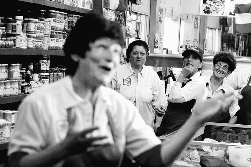 Rosemarie Lippman, left, speaks to a camera, as other workers watch, during the making of a commercial for Claro’s Italian Market in San Gabriel, Calif. With new technology available, commercials can be produced at reduced costs, putting them in reach of small businesses.