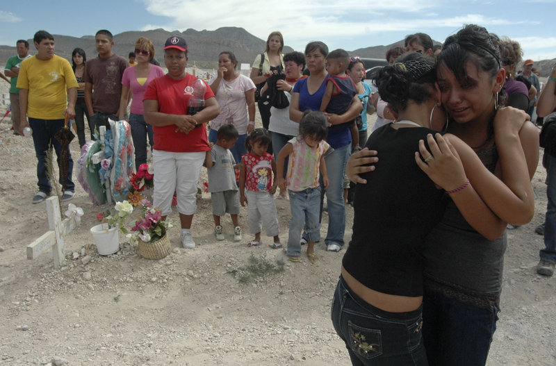 Mourners embrace at the funeral Thursday of Sergio Adrian Hernandez Huereka in Ciudad Juarez, Mexico. The 15-year-old was killed by a bullet fired across the border by a U.S. agent.