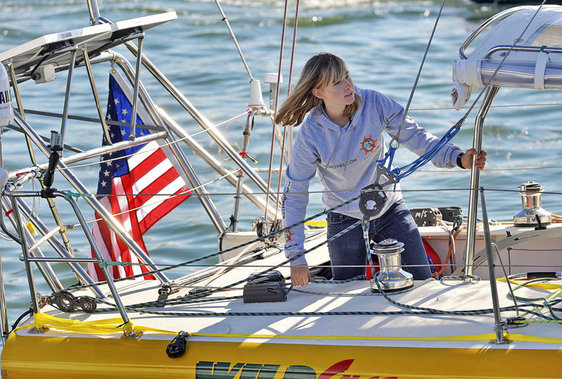 Sixteen-year-old Abby Sunderland looks out from her sailboat, Wild Eyes, as she leaves for her world record-attempting journey at the Del Rey Yacht Club in Marina del Rey, Calif., on Jan. 23.