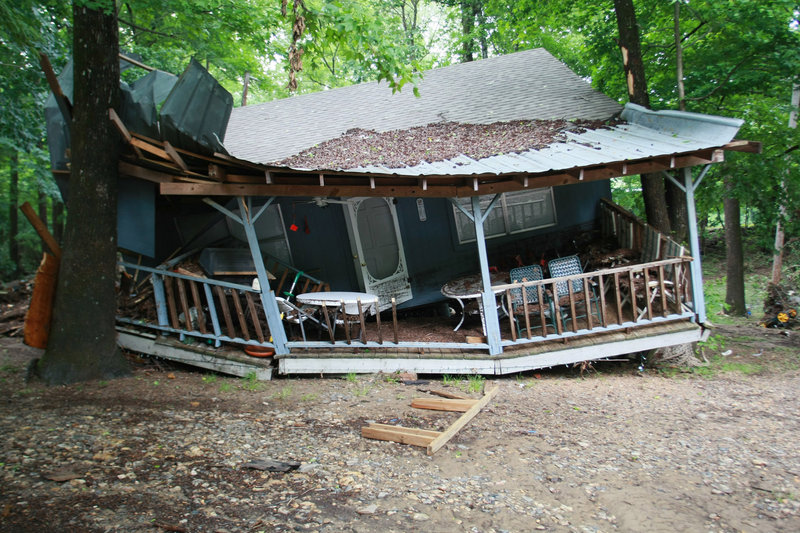 Damage is seen Friday in Langley, Ark., after rain caused a flash flood along the Little Missouri River. Forecasters had warned of the approaching danger during the night, but campers could have missed those advisories because the area is isolated.