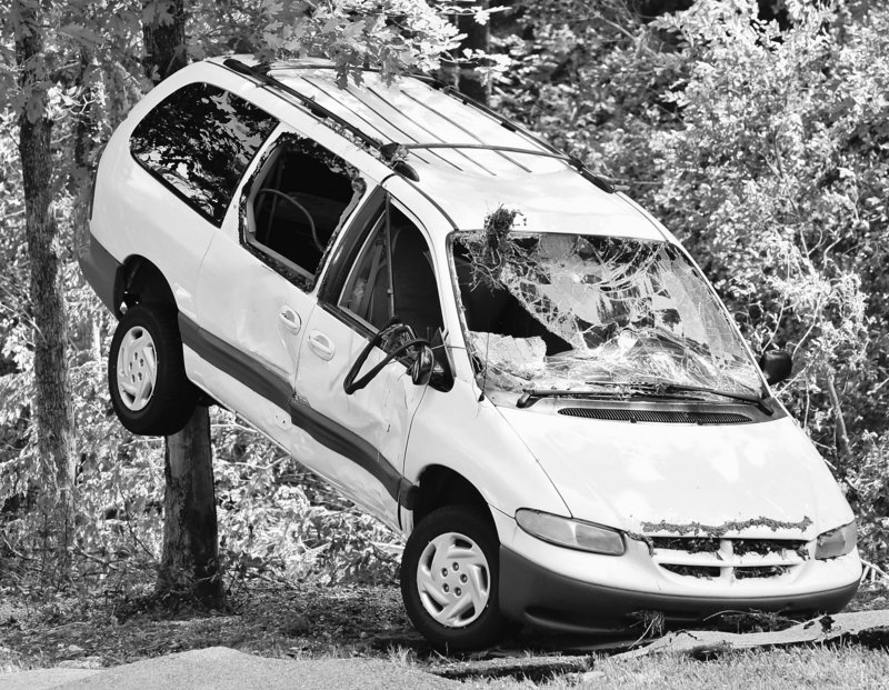 A van sits propped against a tree at Albert Pike campground near Caddo Gap, Ark., on Saturday.