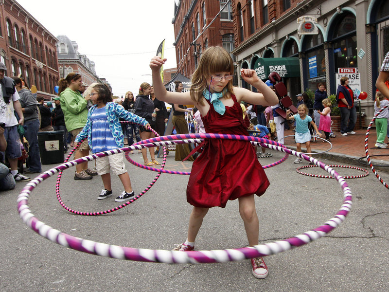 Ruby Day, 7, of Portland has some fun with hula hoops provided by Hoopalula!.