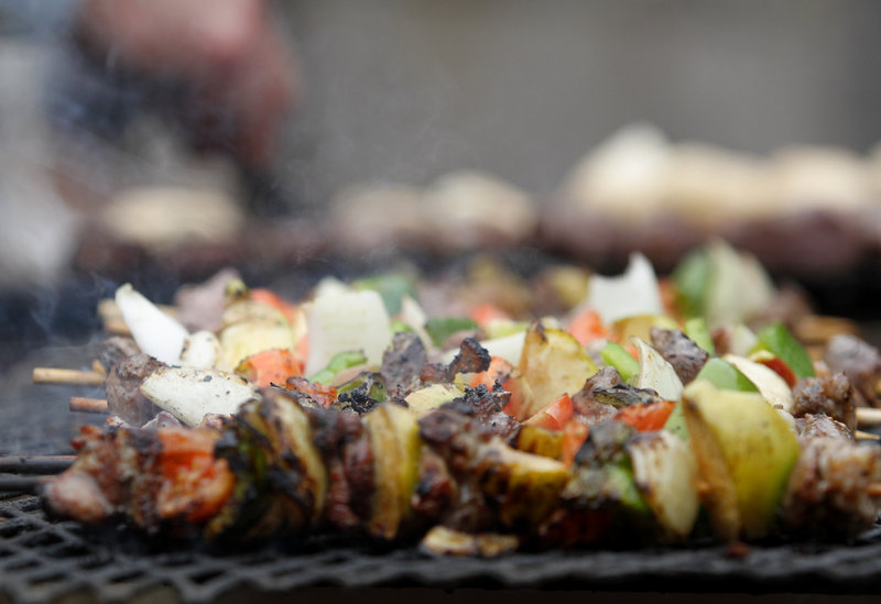 Lamb kabobs from the Noon Family Sheep Farm in Springvale cook on the grill.