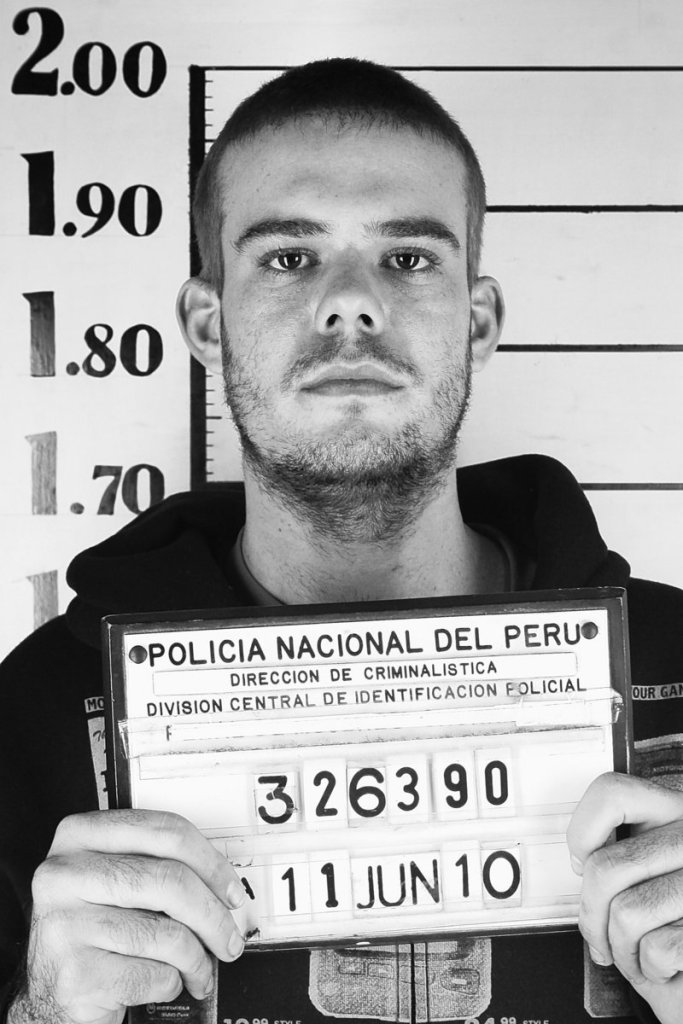 Dutch citizen Joran van der Sloot holds his inmate number before being transferred to a prison in Lima, Peru. After requesting isolation, he now shares a cellblock with a reputed Colombian murderer-for-hire.