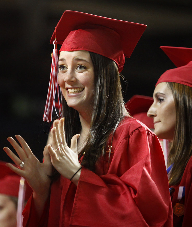 Rebecca Bragg tries to contain her excitement before receiving her diploma during Scarborough High School's commencement exercises on Sunday.