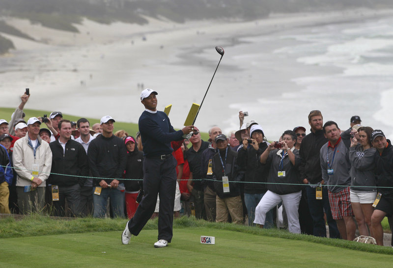 Tiger Woods watches his tee shot on the 14th hole Monday during a practice round of the U.S. Open in Pebble Beach, Calif. The course is dramatically different – and far more difficult – than it was four months ago.