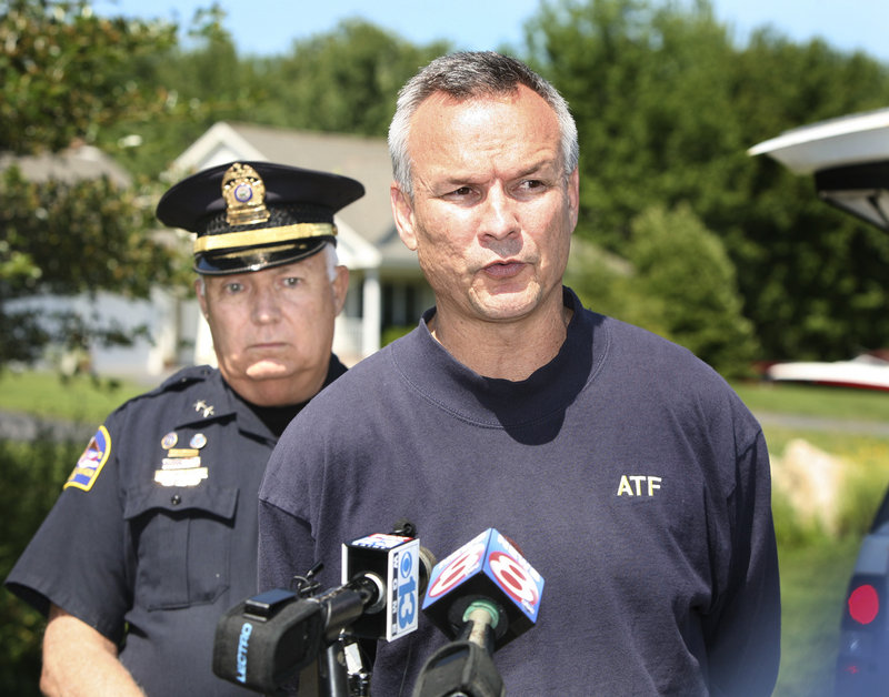 ATF special agent Glen Anderson, right, and Old Orchard Beach Police Chief Dana Kelley address the media in Scarborough after the ATF raid.