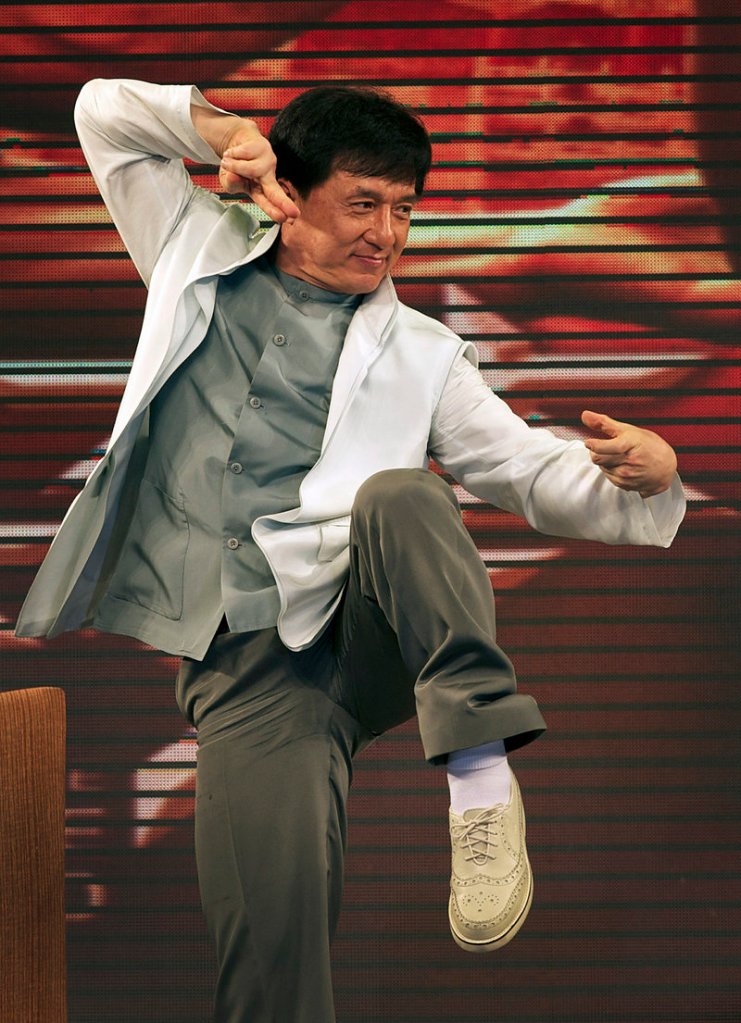 Actor Jackie Chan strikes a martial arts pose on stage while promoting the new movie “The Karate Kid” in Beijing Wednesday. Chan played Mr. Han, a role similar to the Mr. Miyagi character in the 1984 original.
