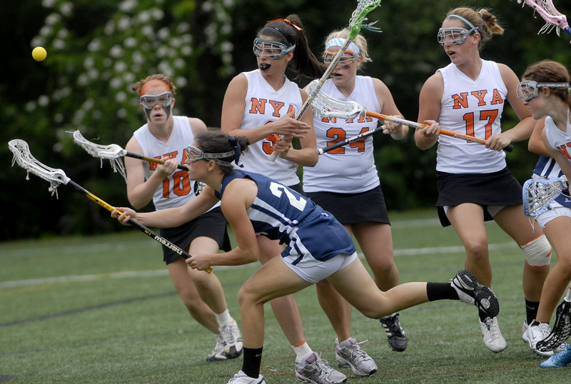 Danielle Torres of Yarmouth tries to beat a host of North Yarmouth Academy defenders to the ball during the Eastern Class B girls' lacrosse final Wednesday at Yarmouth. Top-seeded NYA advanced to the state final with a 9-5 victory.