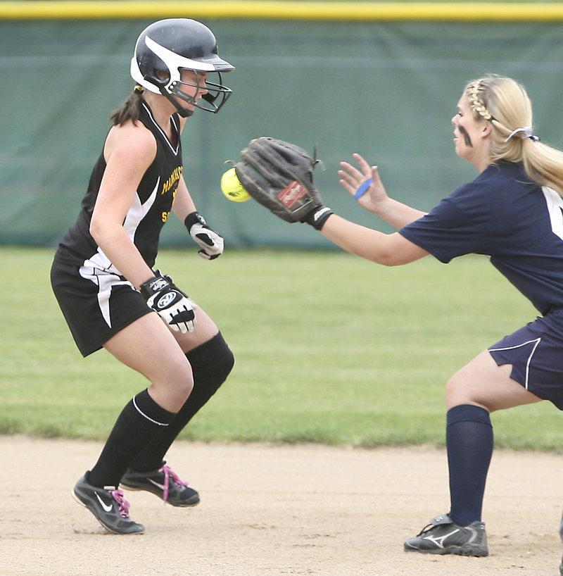 Heidi Shaw of Maranacook is tagged out at second base by Ariel McConkey of Fryeburg Academy after getting caught in a rundown Wednesday, Fryeburg won, 4-3.