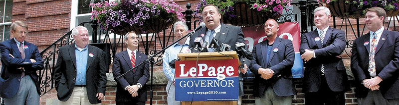 Republican Paul LePage speaks Wednesday in front of Waterville City Hall, ringed by former rivals, from left, Les Otten, Josh Tardy, who declined a nomination, Steve Abbott and Matt Jacobson.
