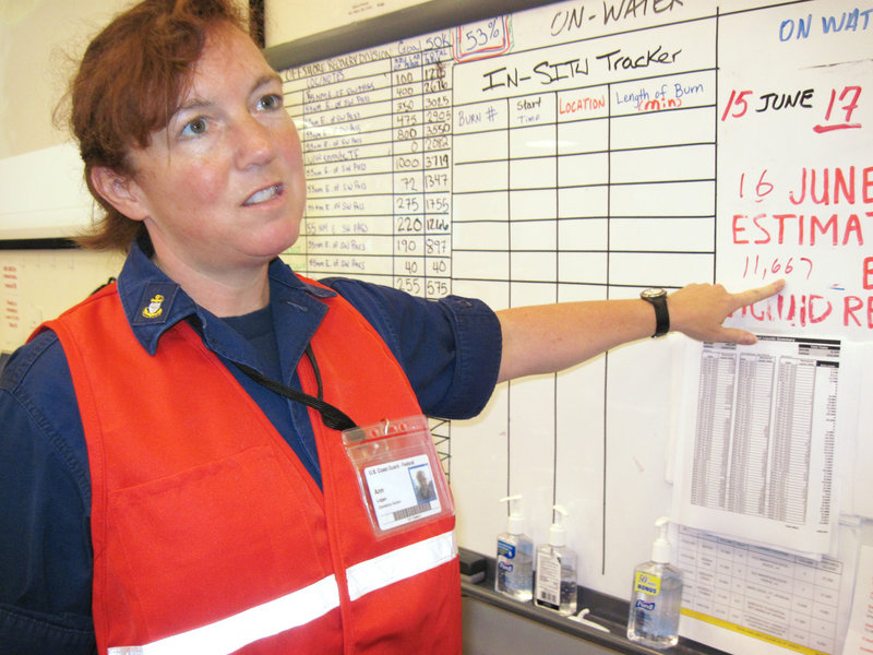 Coast Guard Marine Science Technician Ann Logan of Westbrook has been directing oil-skimming boats off the coast.
