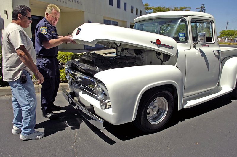 Harold Voelker and California Highway Patrol Officer Greg Bennett check out the 1956 Ford F-100 truck that was stolen from Voelker in 1972 and recovered only this week. Bennett ID’d the long-lost vehicle.