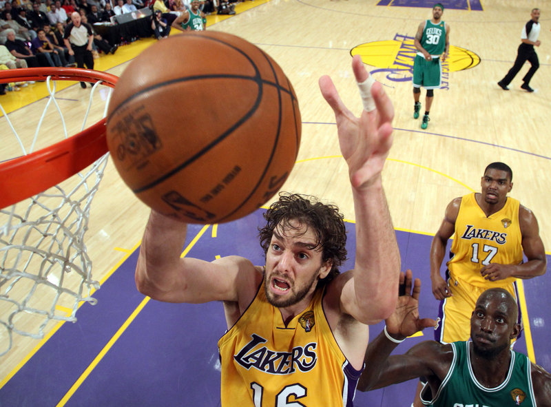 Pau Gasol of the Los Angeles Lakers makes room inside Thursday night to pull down a rebound during the first half of the Game 7 showdown against the Boston Celtics.
