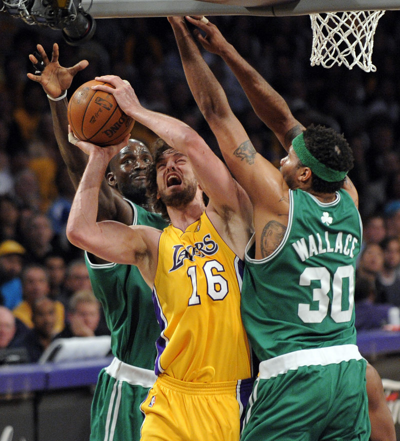 Pau Gasol of the Los Angeles Lakers has trouble finding room Thursday night while guarded by Rasheed Wallace, right, and Kevin Garnett of the Boston Celtics. The Lakers won.