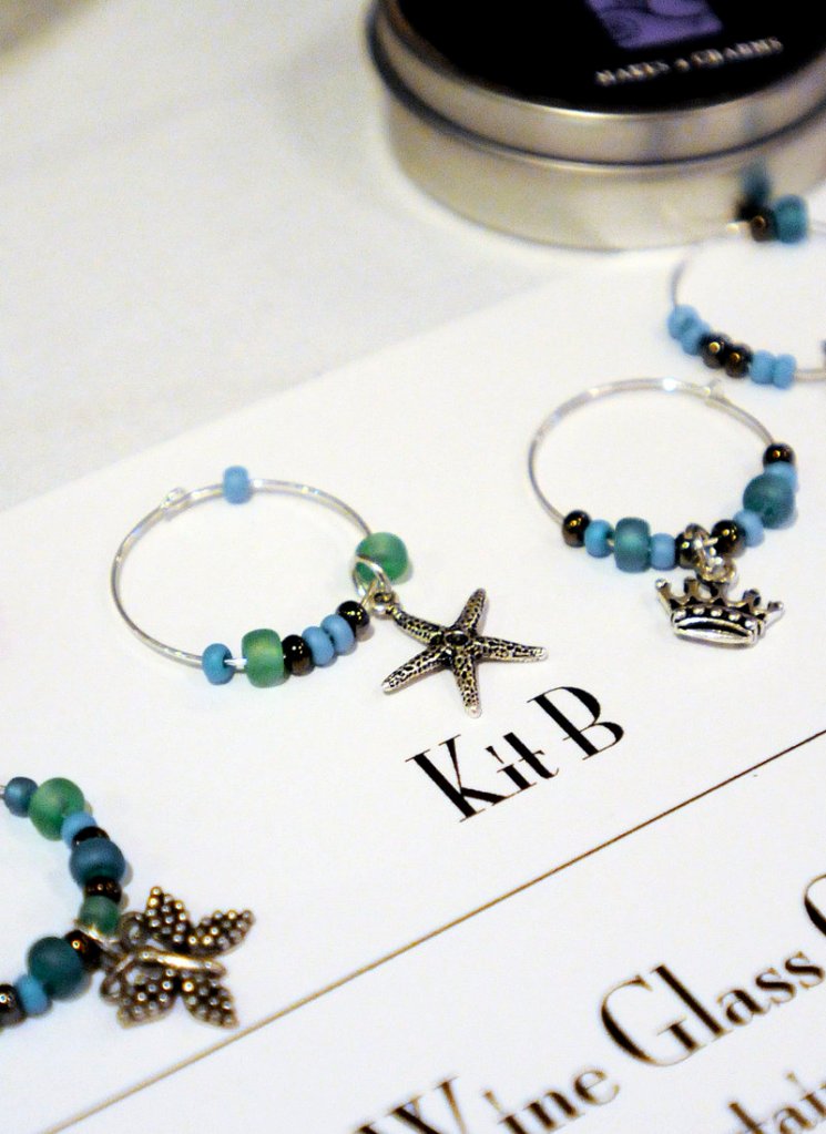 Wine charms are one of six Art Night Out kits designed by entrepreneur Catherine Bickford. Bickford sought advice on marketing the kits from those attending a Women Standing Together lunch at the Portland Harbor Hotel. Group members help each other overcome business challenges.