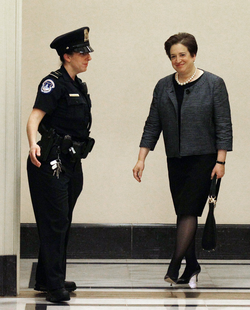 Supreme Court nominee Elena Kagan walks to a meeting on Capitol Hill in Washington last month.