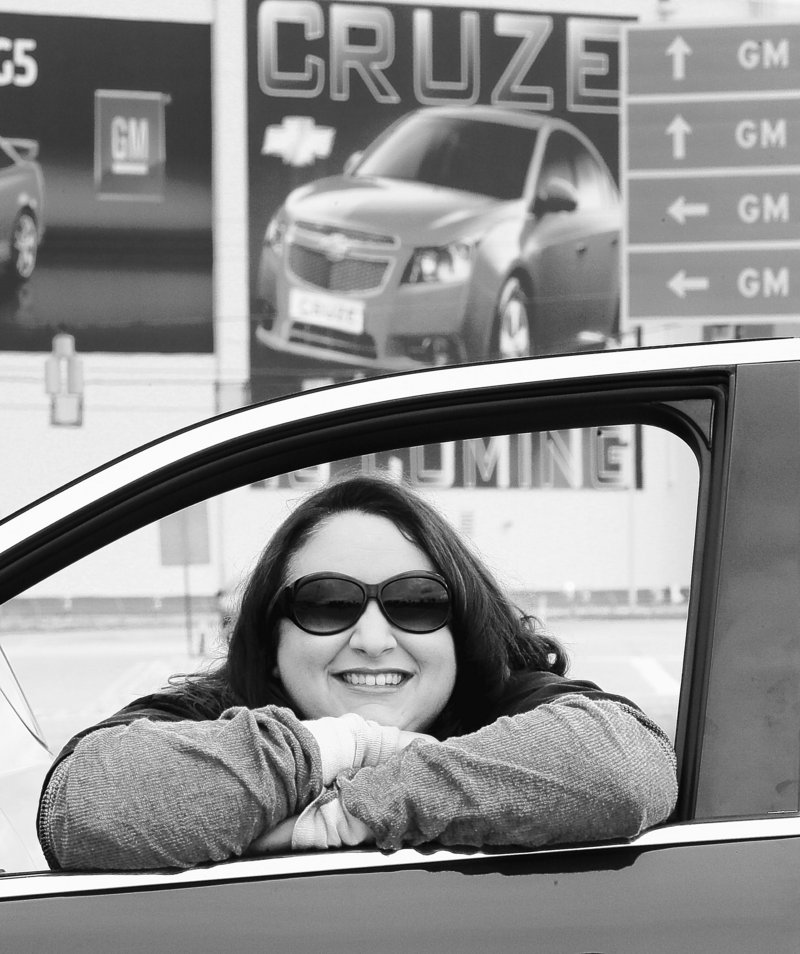 United Auto Workers member Bobbi Marsh looks out the window of her new Chevy Equinox outside the GM plant in Lordstown, Ohio on Thursday. Laid off from several teaching jobs, Marsh is glad to have found employment at the plant.