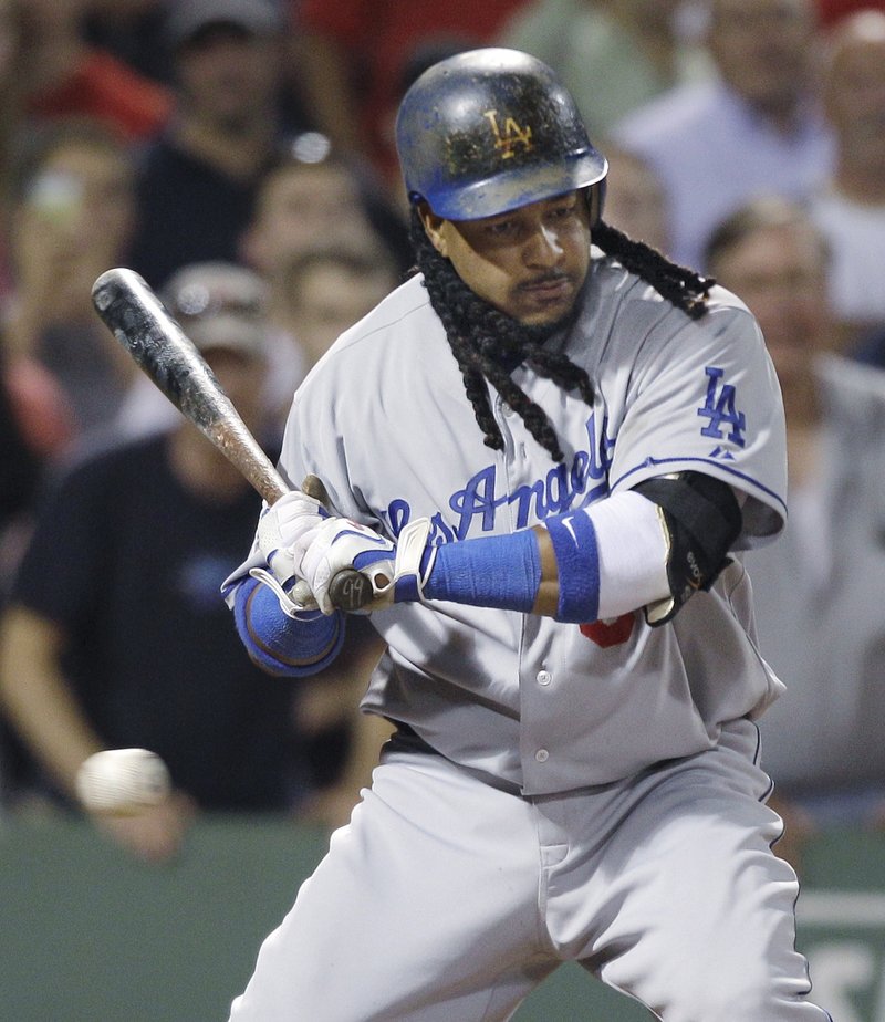 Manny Ramirez watches a third strike zip by in the ninth inning Friday night to end the game with two runners on. Boston beat the Los Angeles Dodgers, 10-6.