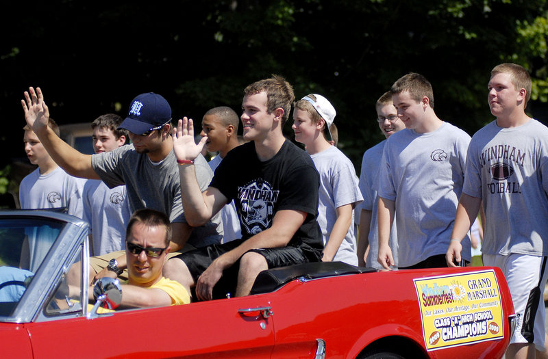 Members of Windham High's 2009 football team – the state champions – march as a collective Grand Marshal of the parade.