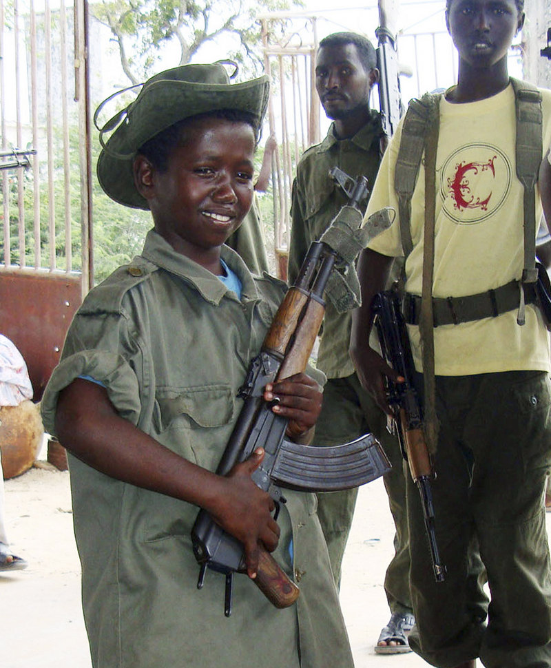This 2009 photo shows a child soldier of the Somali government on patrol in the streets of southern Mogadishu.