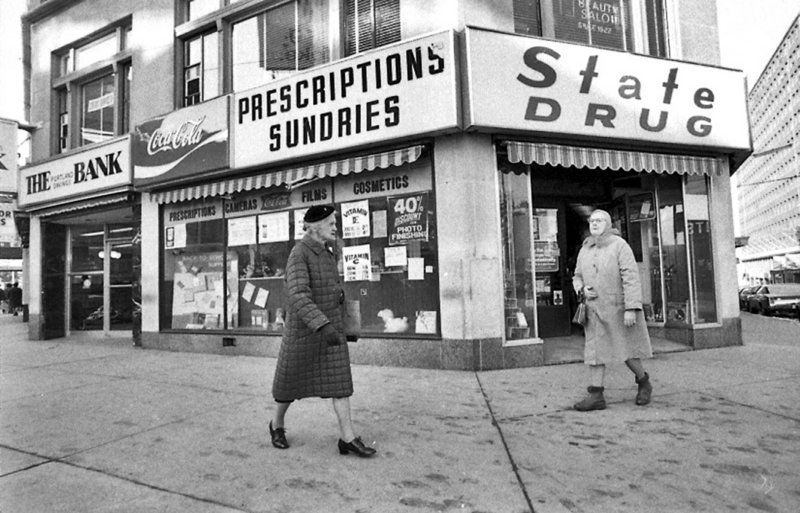 Pedestrians walk by the State Drug store at the corner of High and Congress streets in Portland in the mid-1970s.