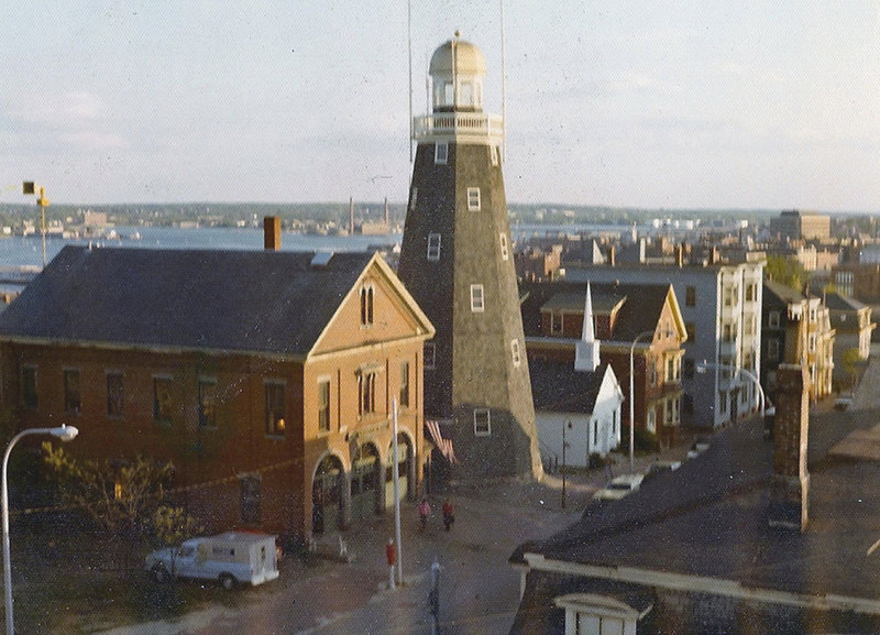 The Portland Observatory and Munjoy Hill Firehouse in 1976, the year the 1864 firehouse was razed.