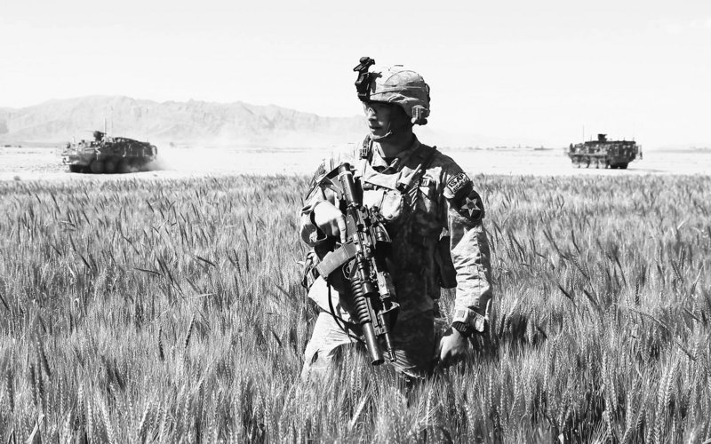 A U.S. Army soldier patrols in Kandahar province this spring. Additional troops are expected to be in Afghanistan by the end of the summer, bringing the U.S. troop level to 105,000.