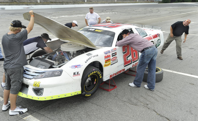 Brad Keselowski waited patiently Thursday at Oxford Plains Speedway as the pit-crew members worked on the car he’ll drive next month in the TD Bank 250. The crew is from the Vermont-based Roberts Racing team.