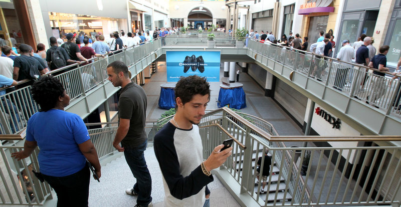 Photos by the Associated Press Yaniv Yarkony uses his old iPhone to record video while standing in line Thursday for the new Apple iPhone 4 at Lenox Mall in Atlanta.