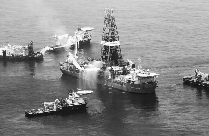 The drilling rig Discoverer Enterprise recovers oil from the leaking Deepwater Horizon site in the Gulf of Mexico earlier this month. BP is deploying deep-water sensors to better determine the amount of oil leaking from the uncapped well, at the same time that work continues on drilling two relief wells.