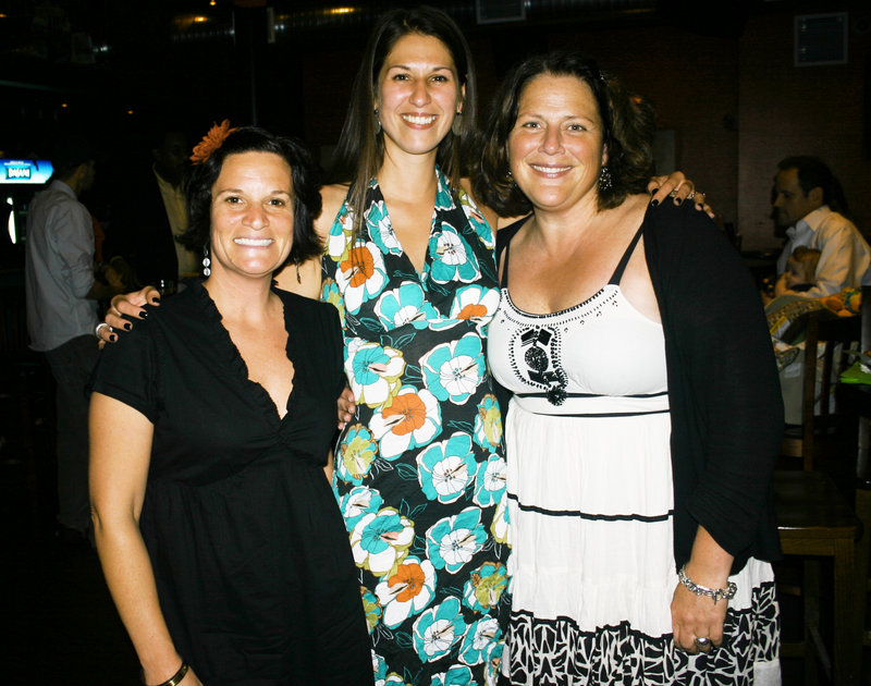 Stephanie Volo, Planet Dog’s CEO, Denise Saaf, marketing manager for Planet Dog, and Kristen Smith, executive director of the Planet Dog Foundation