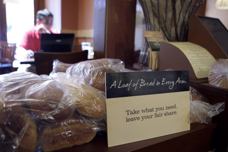 A sign in Panera Bread Co.’s nonprofit restaurant in Clayton, Mo., invites customers to help themselves to bread. The idea is that the richer will pay full price, the poorer, less or none.