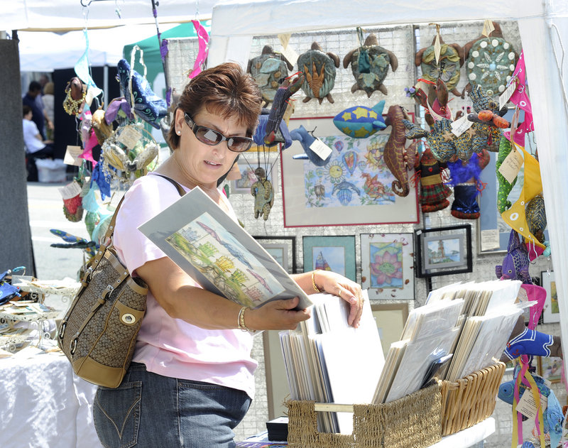 Theresa Casamassa of Saco goes through a basket of prints.