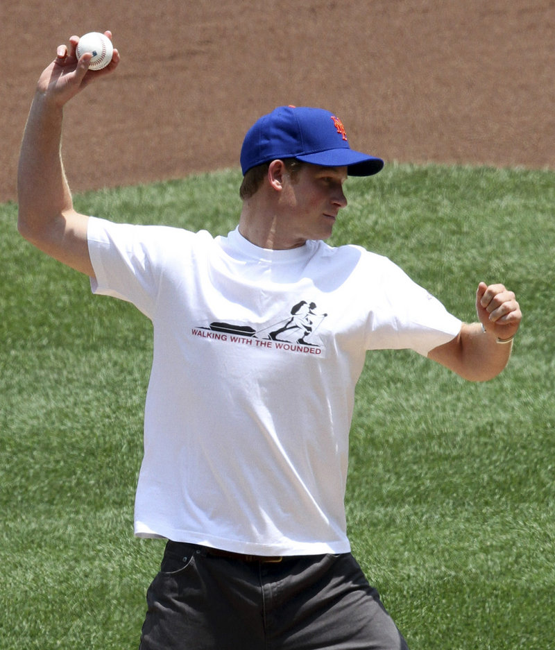 Britain's Prince Harry, 25, throws out the ceremonial first pitch before a baseball game between the New York Mets and the Minnesota Twins on Saturday in New York. The prince threw with some zip to Mets catcher Rod Barajas. Mets knuckleballer R.A. Dickey gave Harry throwing advice before the game. Earlier the prince visited with UNICEF staff at the United Nations.