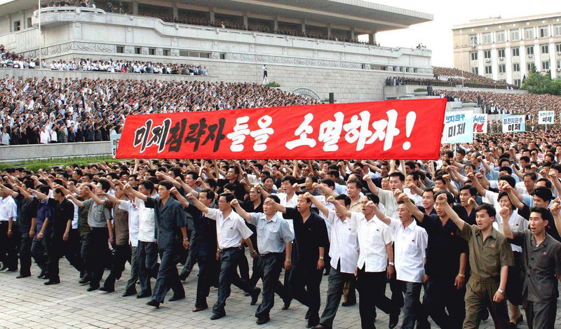 North Koreans chant anti-U.S. slogans in Pyongyang Friday as they mark the 60th anniversary of the start of the Korean War. The country’s ruling party will choose new leaders this fall.