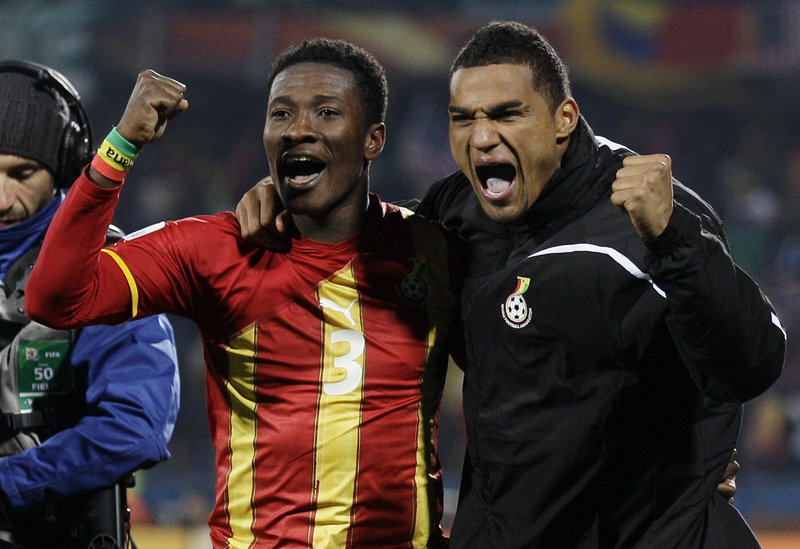 Asamoah Gyan, left, and Kevin-Prince Boateng of Ghana will be heading to a quarterfinal game against Uruguay after eliminating the United States with a 2-1 victory Saturday.