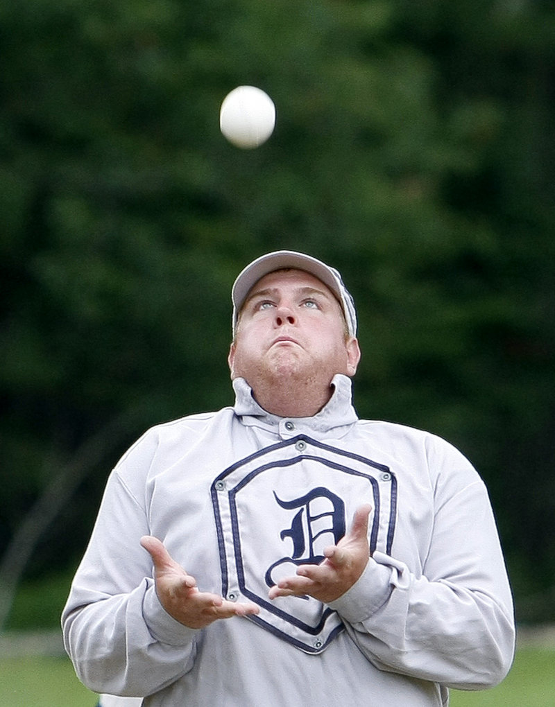 Jacob “Shoeless” Newcomb of Bath prepares to catch a fly ball barehanded for the Dirigo team.