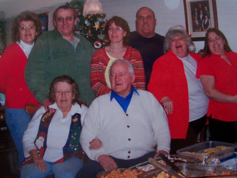 The Cousins family is shown: first row, Mrs. Dorothy Cousins and Alton; back row, Lu Ann, Donald, Gail, Lee, Sandra, Ruth.