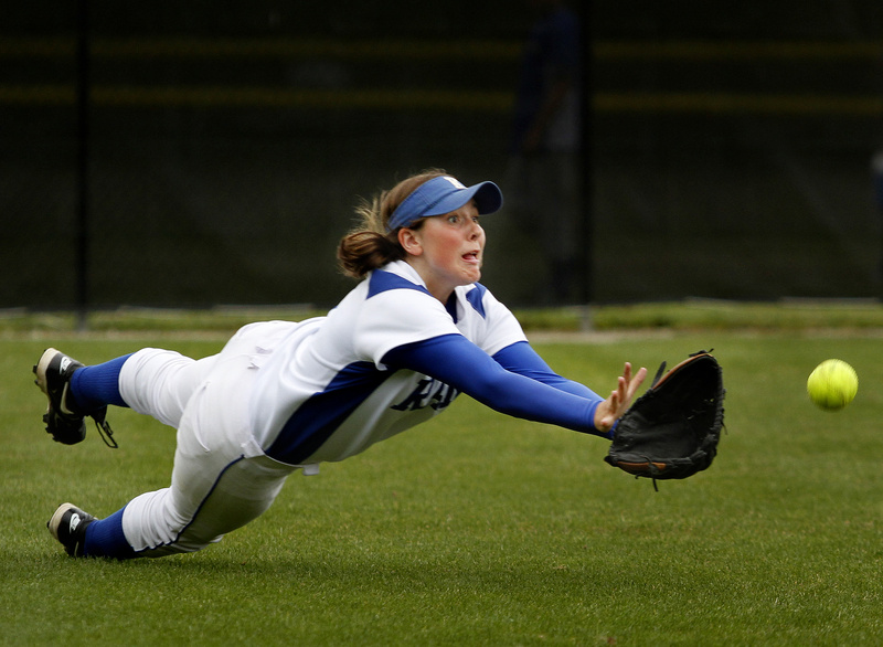 Kelsey Livermore of Kennebunk dives in a vain attempt to snag a fly ball in left field during the 7-4 loss at South Portland in a Western Class A semifinal.