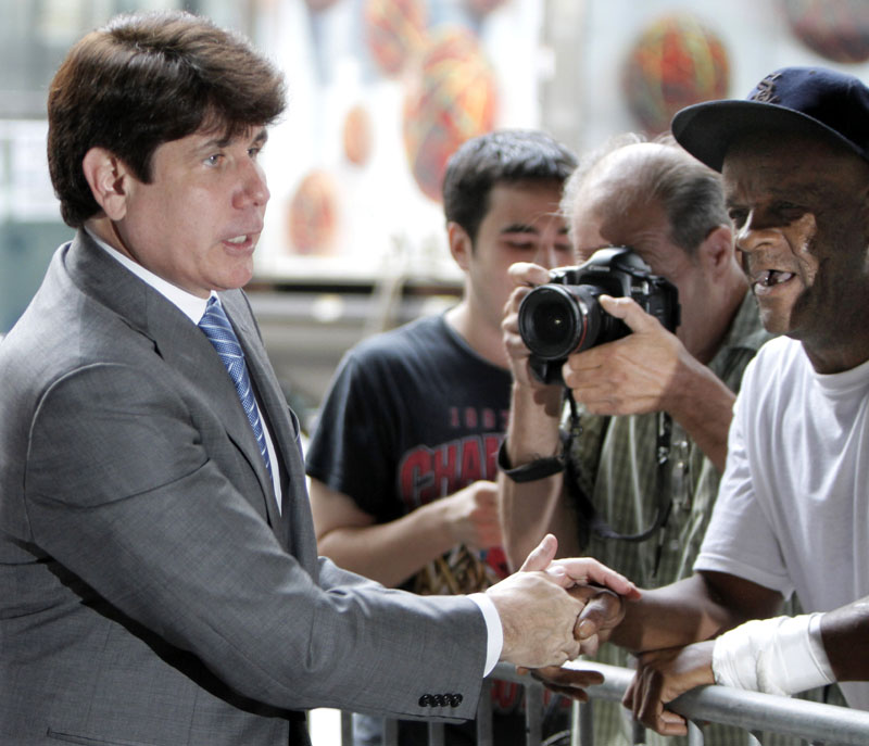 Former Illinois Gov. Rod Blagojevich shakes hands with supporters as he arrives at the Federal Court today in Chicago. Blagojevich and his brother are accused of scheming to sell or trade President Obama's old Senate seat.