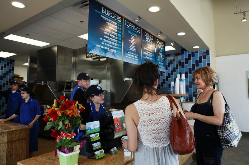 Alexandra Decores, 22, left, and her mother Irena Mihalikova, of Potomac, Md., order lunch at Elevation Burger, in Potomac, Md., last month. Elevation Burger uses organic, grass-fed beef and sells fries cooked in olive oil.
