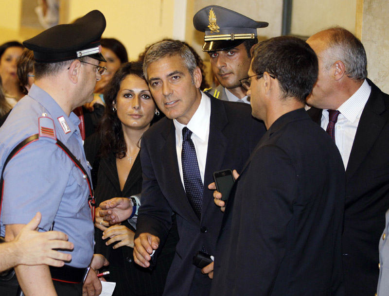 George Clooney leaves court in Milan, Italy, today.