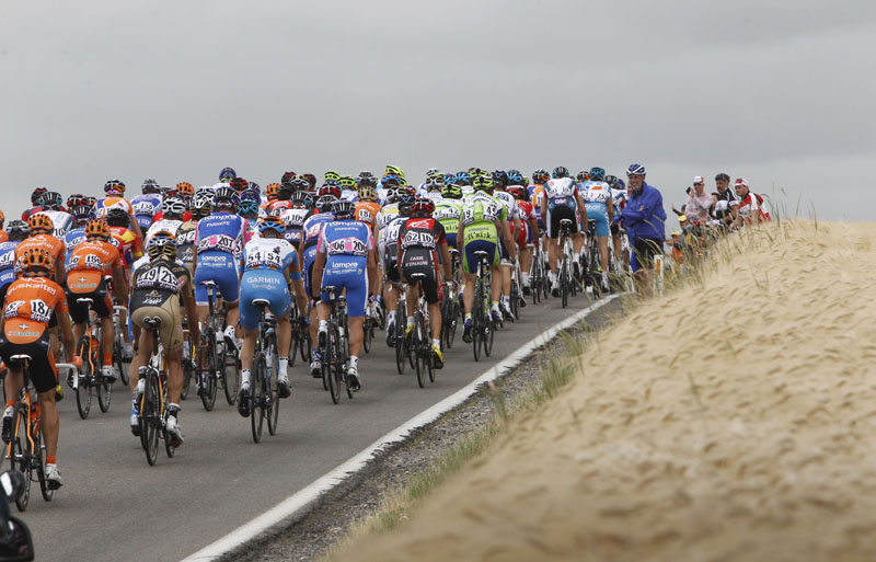 The pack rides during the second stage of the Tour de France over 201 kilometers (125 miles) with the start in Brussels and the finish in Spa, Belgium, today.