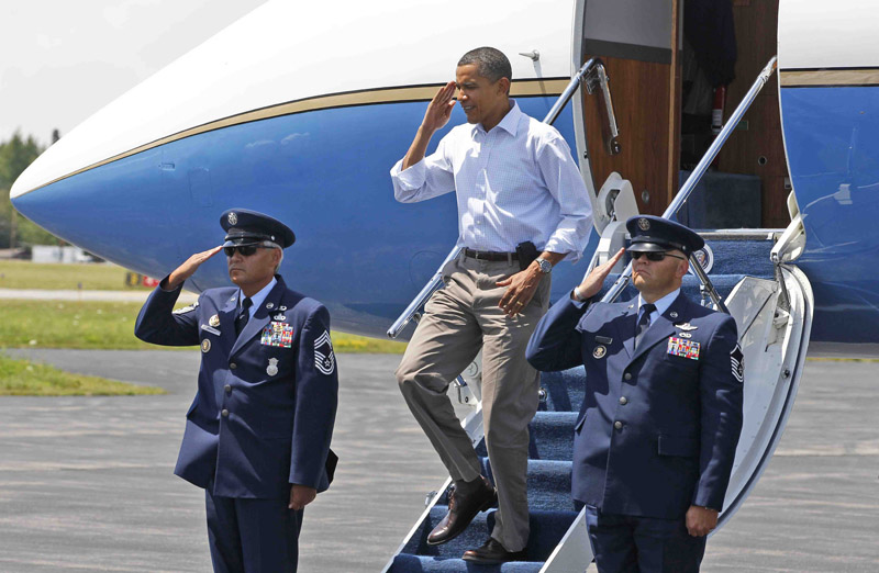 President Barack Obama salutes upon his arrival in Trenton.