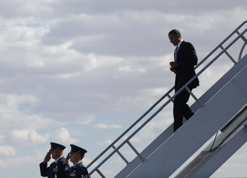 President Barack Obama walks down the stairs during his arrival at McCarran International Airport in Las Vegas, Thursday, July 8, 2010.